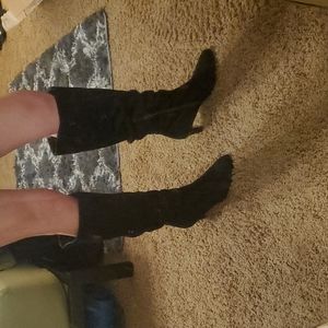 Knee high black stilettos boots